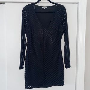 Black long sleeve cocktail dress.